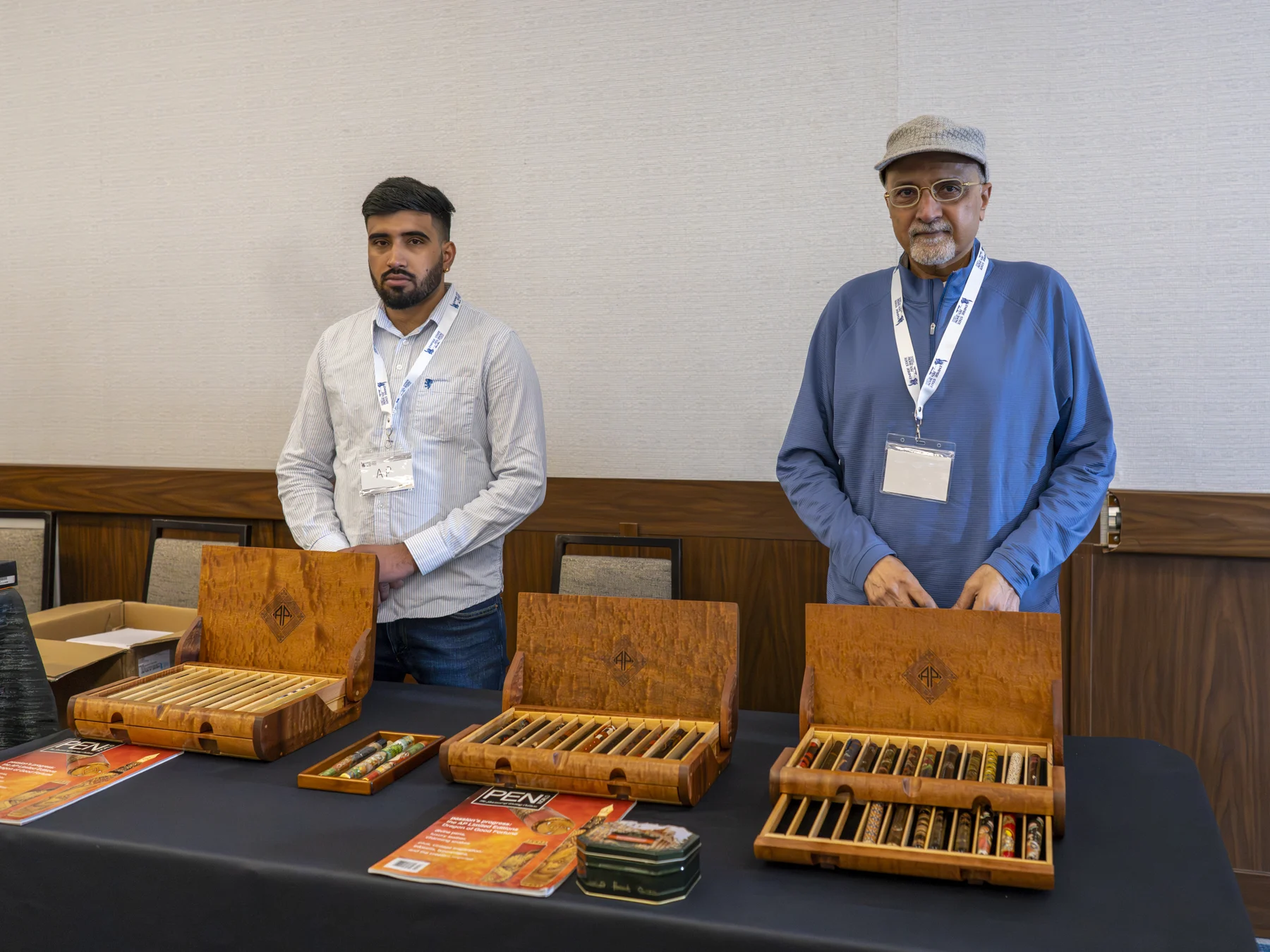 Exhibitors with wooden pen cases at the 2025 Empire State Pen Show