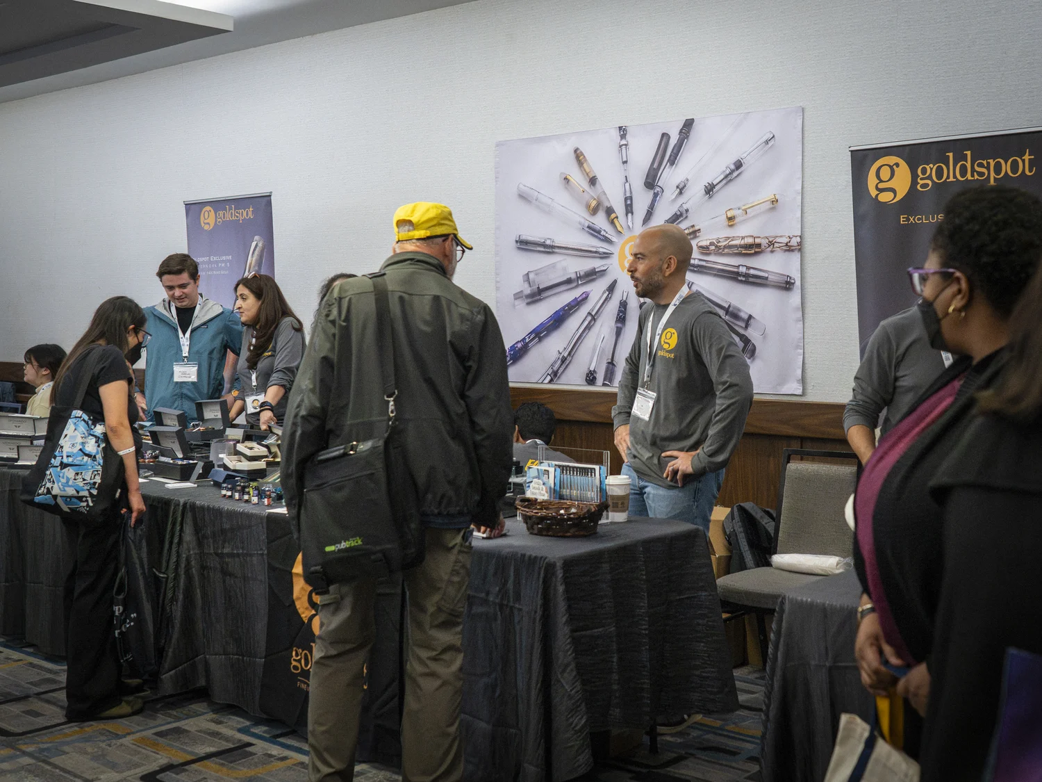 Visitors exploring exhibitor tables at the 2025 Empire State Pen Show
