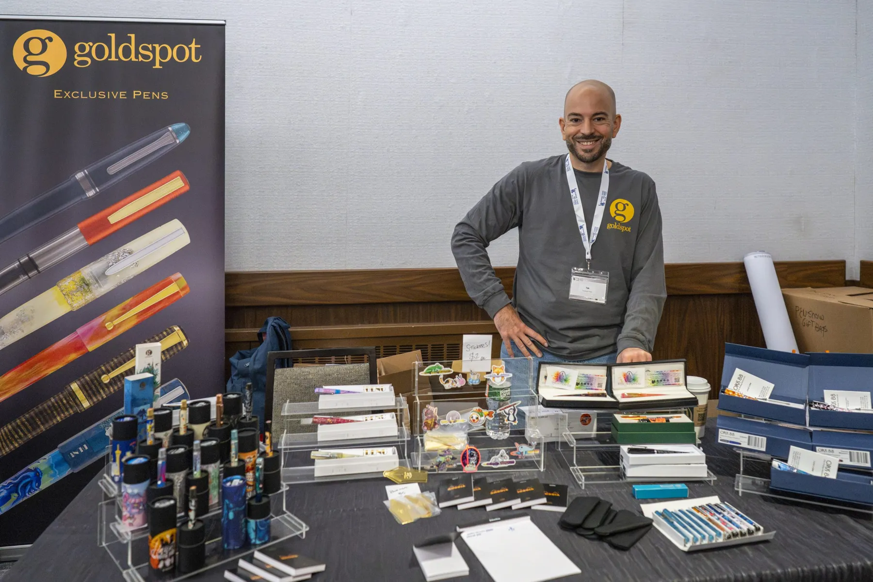 A Goldspot exhibitor with pens and stationery at the 2025 Empire State Pen Show